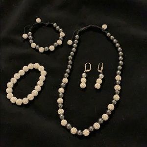 Necklace, two bracelets and earring set.